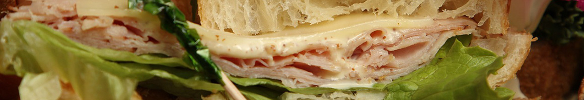 Eating American (Traditional) Sandwich at Original Captain Harvey's Submarines @Logan village shopping center restaurant in Dundalk, MD.